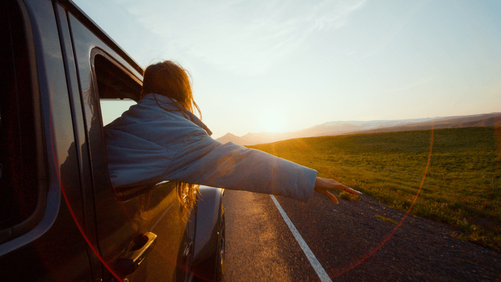 car rental tip, spring, blue car rental women in a rental car from blue car rental in spring.