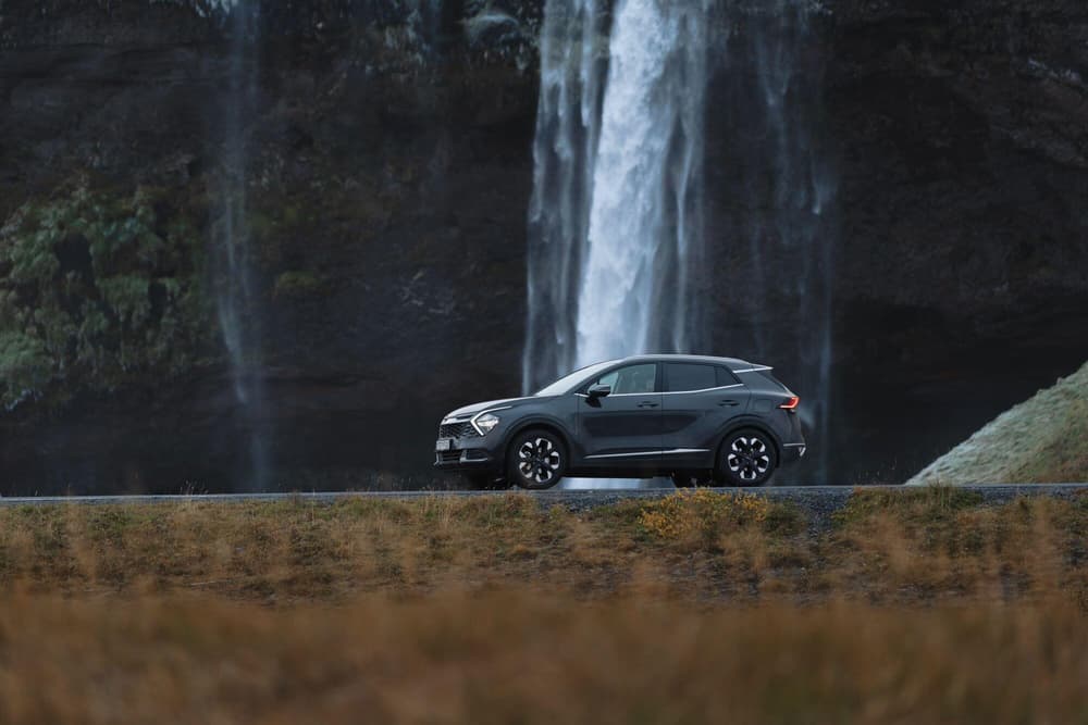 Iceland rental car at seljalandsfoss waterfall
