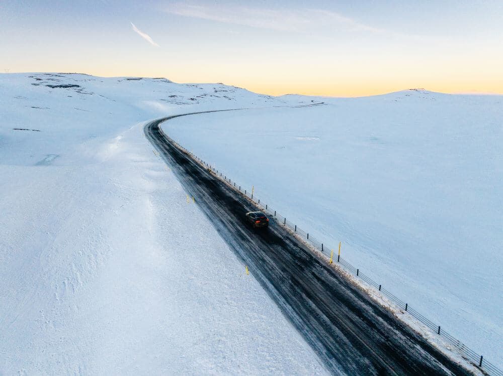 Rental car driving a winter road in iceland