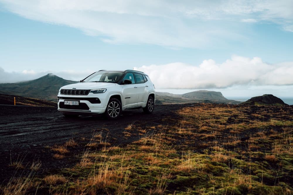 Self-guide tour Blue Car rental Rental car on a mountain road in iceland.