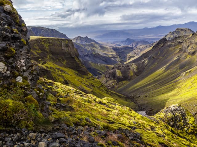 Deep green valley and canyon seen from a mountain ridge at Fimmvorduhals
