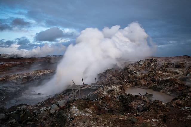 Steam rising at Gunnuhver. Steam billowing from Gunnuhver geothermal area with mineral-crusted ground