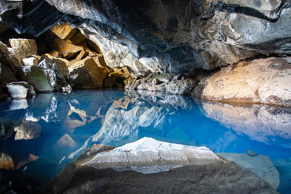 Grjótgjá cave. Blue hot spring water inside of Grjótgjá cave in north Iceland.