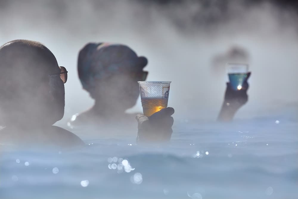 People drinking Icelandic beer in the Blue Lagoon.