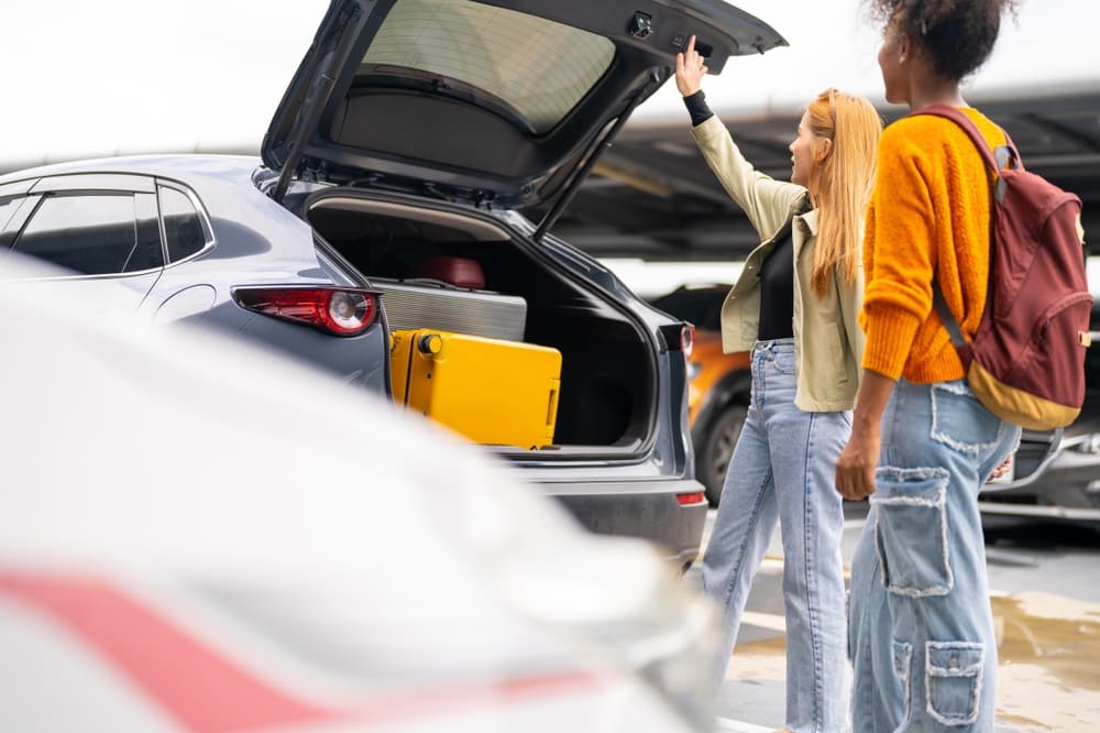 Kef airport rental car. People putting luggage in a rental car at Kef airport