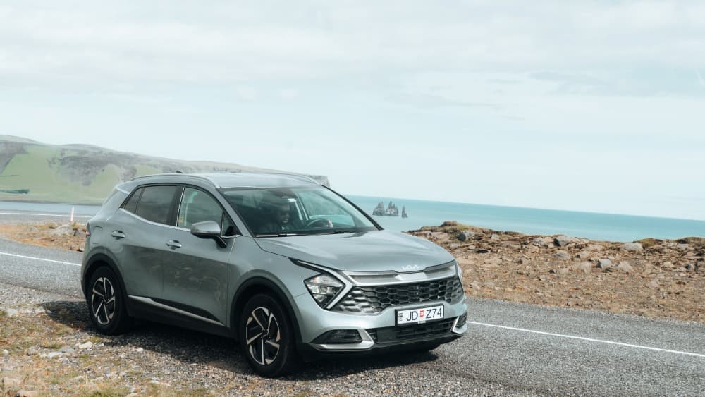 Kia Sportage rental car at Dyrhólaey south Iceland.