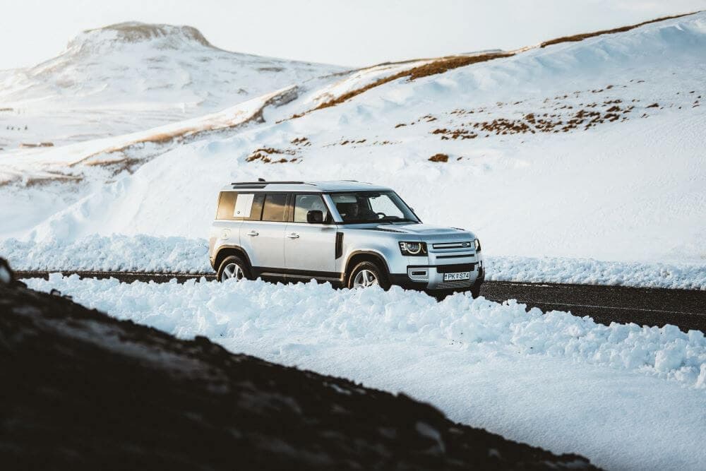 Blue car rental defender winter trip cost Land Rover Defender winter driving in iceland