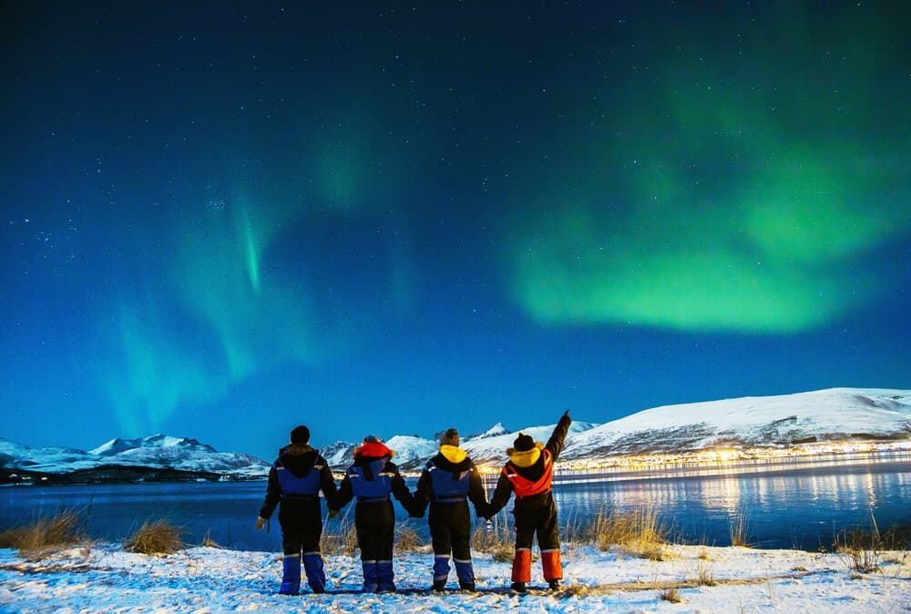 Iceland winter festival with the northern lights above the crowed.
