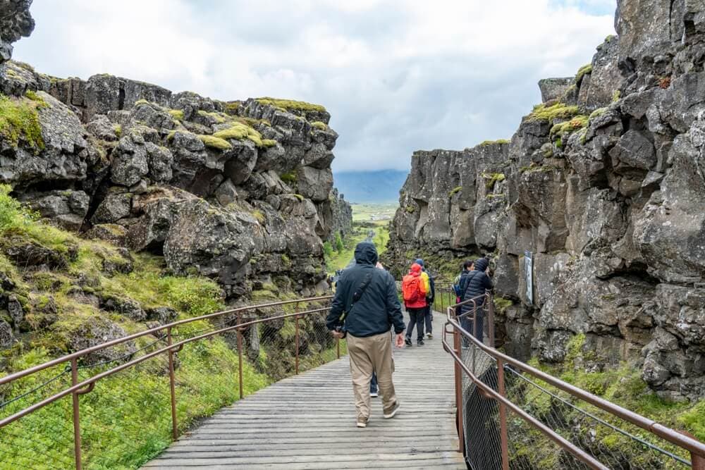 Thingvellir Iceland national park. Blue Car Rental Almannagjá at Thingvellir National Park
