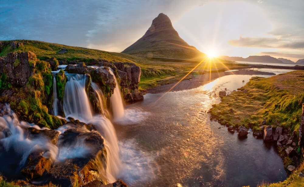 Kirkjufell mountain and waterfall in the midnight sun.