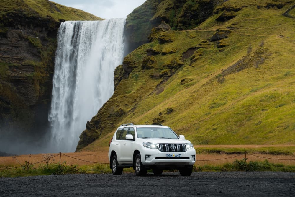 Skogafoss waterfall and 4x4 from Blue Car Rental.
