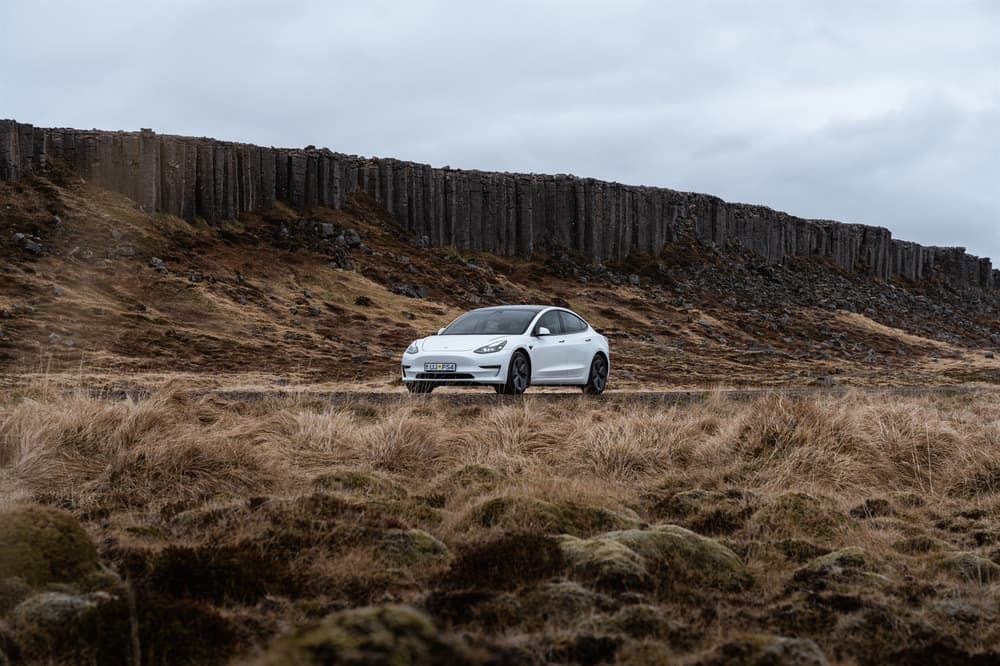 Tesla on Iceland roand Tesla driving in Iceland country side.