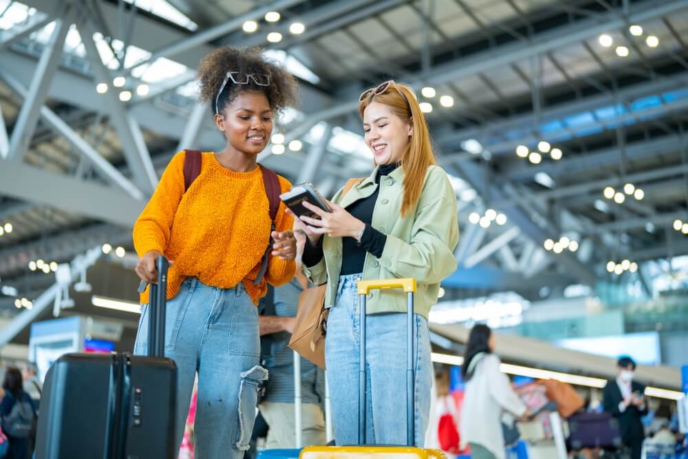 Traveler using phone for digital check-in / Wallet Pass Supports the digital journey concept: online check-in, Wallet Pass, less paperwork, faster pickup.