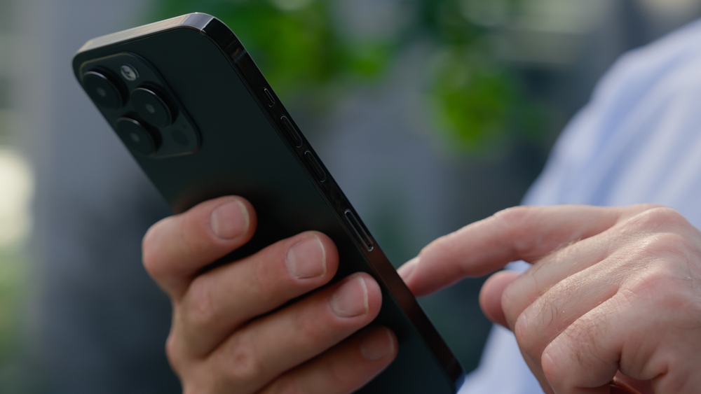 Person checking the phone connection in Iceland.