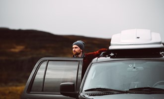 driver with rental car in Iceland