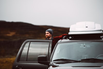 driver with rental car in Iceland
