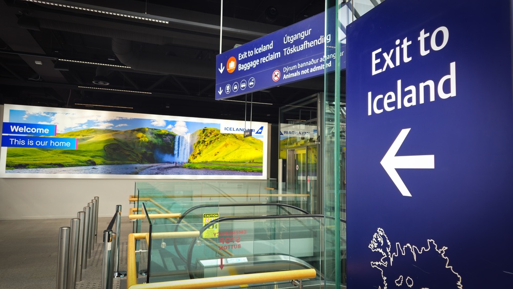 Kef airport terminal. Sign at Kef terminal where to exit to Iceland.
