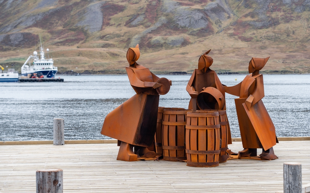 Siglufjordur. Iron sculpture of fishing women in Siglufjordur.