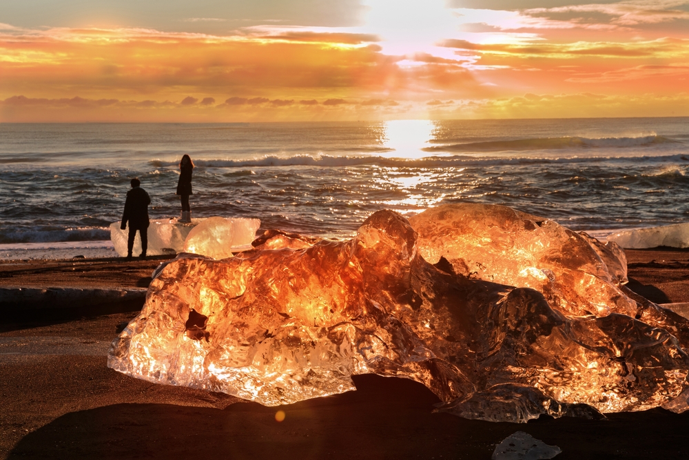 Diamond beach in Iceland. Crystal ice in an orange glow on Diamond beach in Iceland.