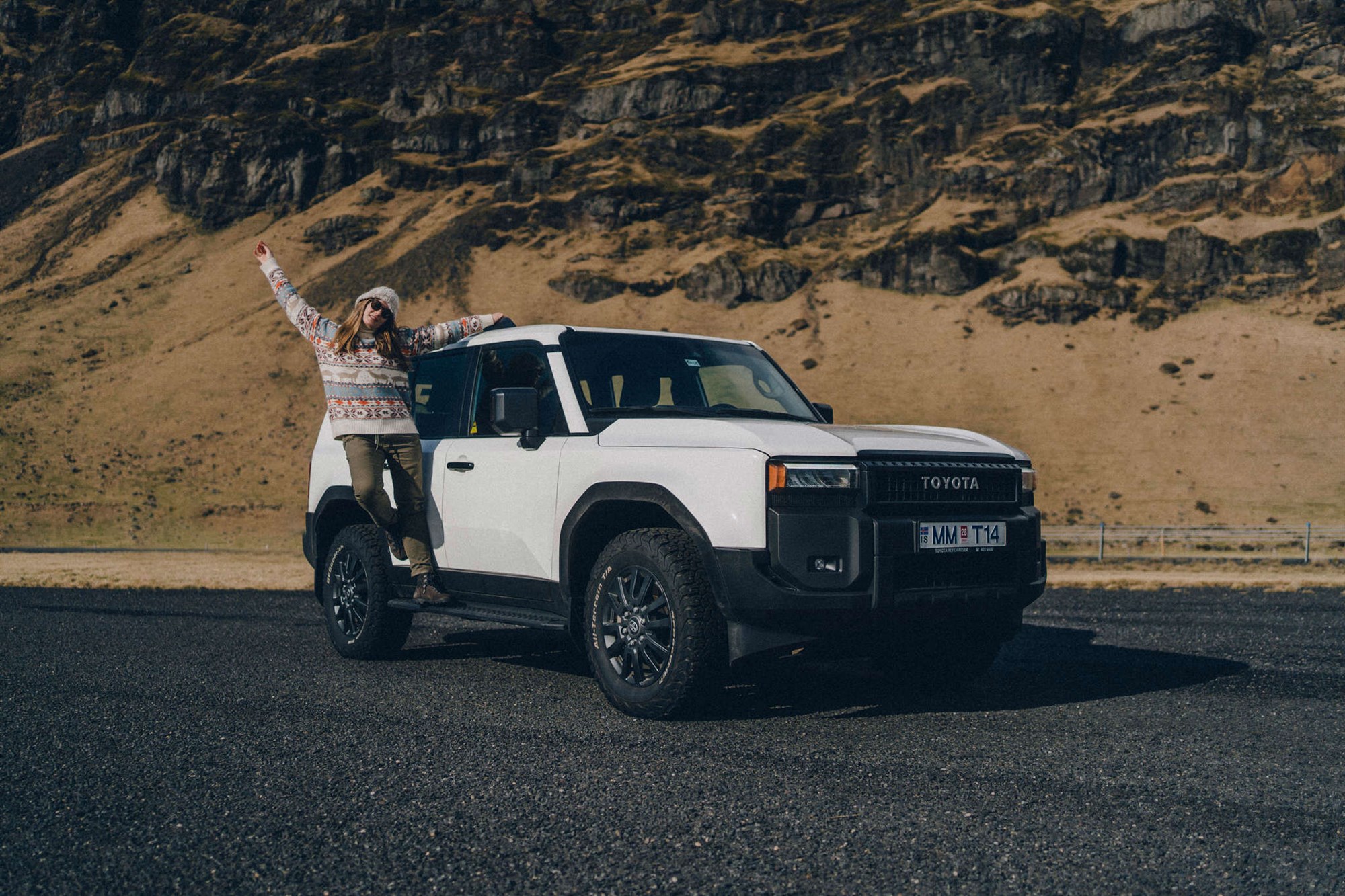 Happy customer with rental car in Iceland. Happy customer with rental car in Iceland.