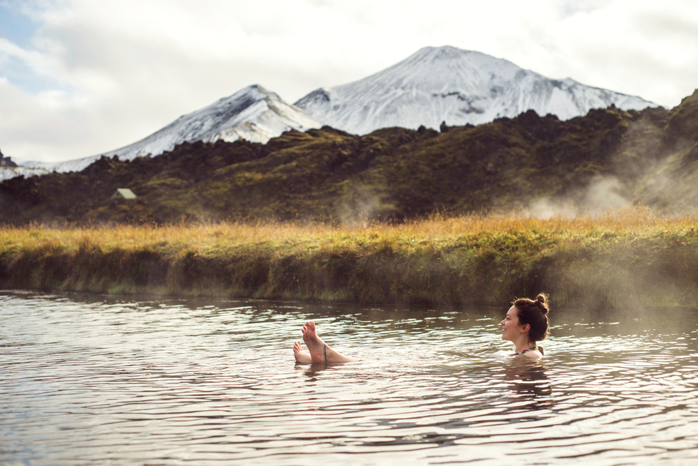 Women relaxing in the natural hot pool at Landmannalaugar.