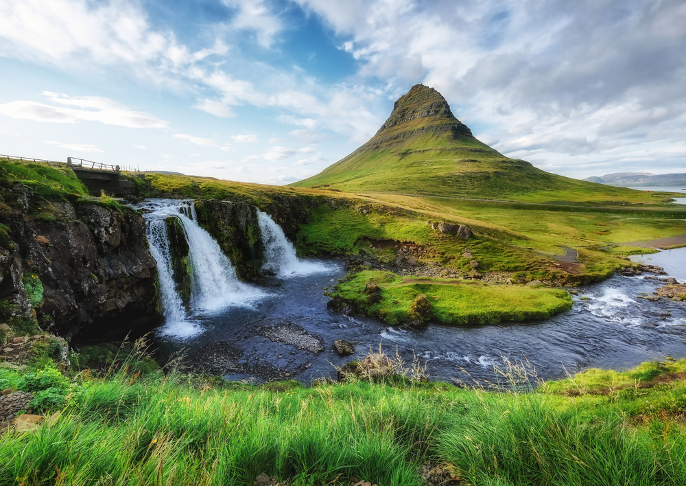 Kirkjufell mountain and waterfall at Snæfellsnes peninsula in Iceland in summer.