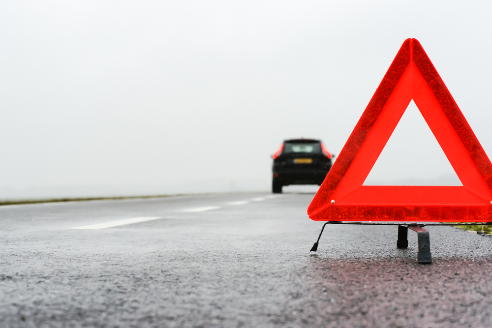 Red tringle on a road in Iceland for assistance.
