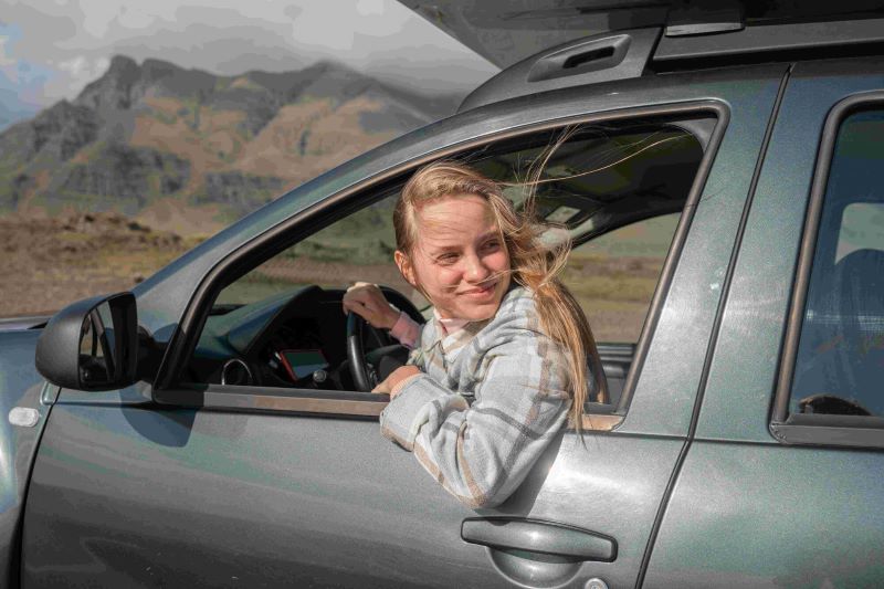 Young women driving in Iceland.