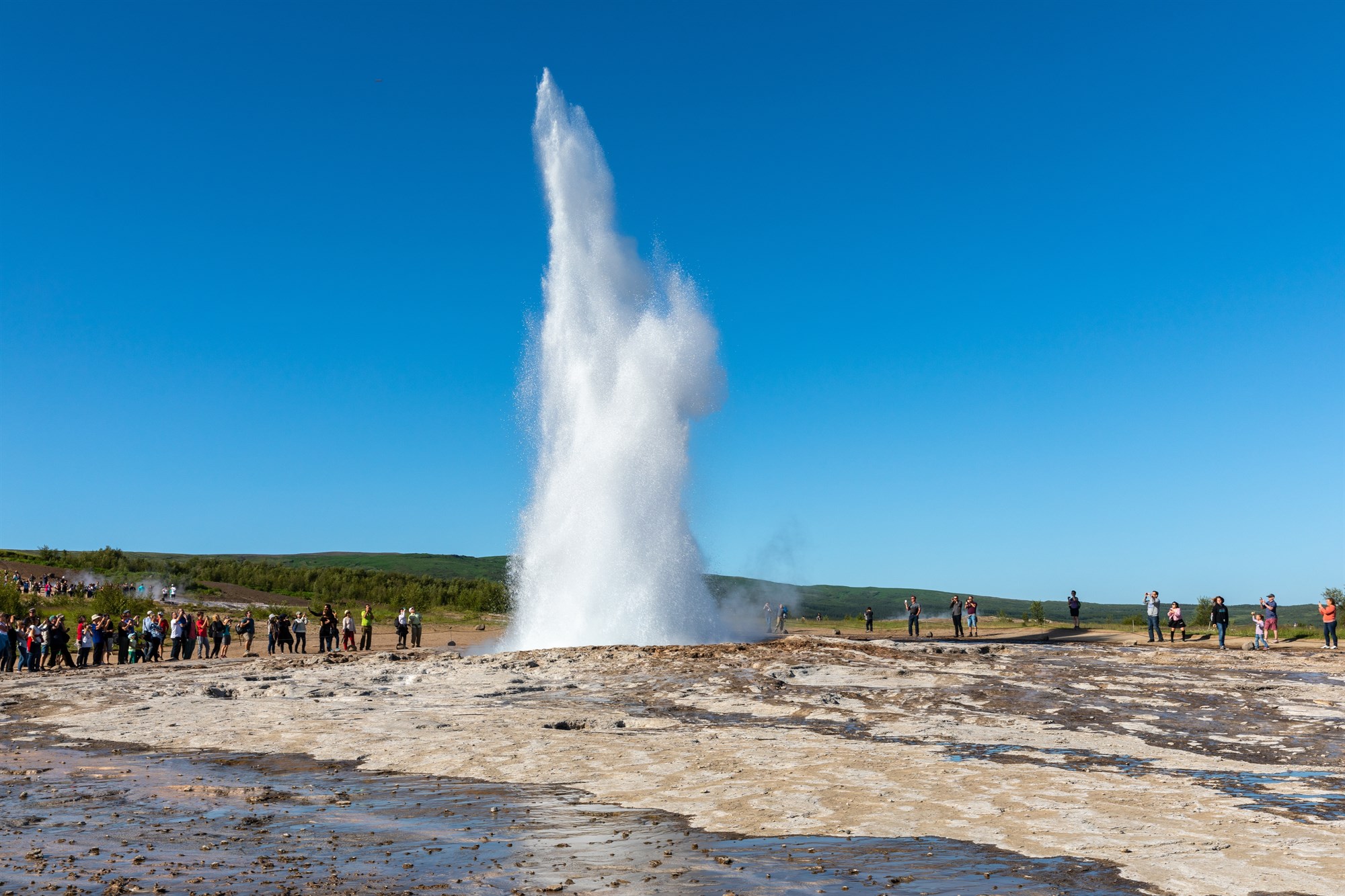 The geyser Strokkur erupting at the geyser geothermal area in Iceland.