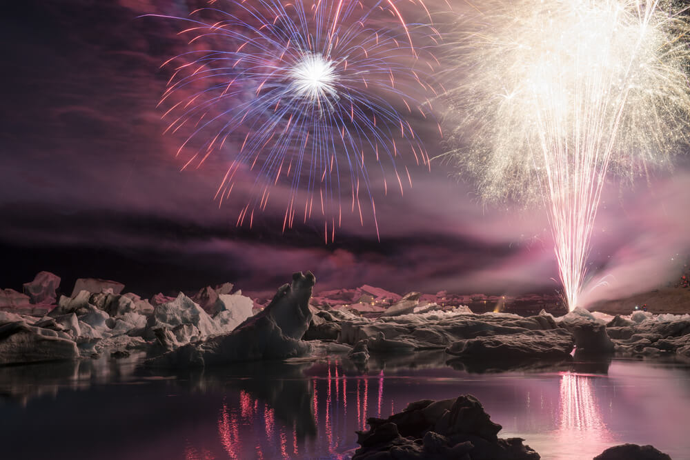 Annual firework show among icebergs at Ice lagoon Jokulsarlon, Iceland