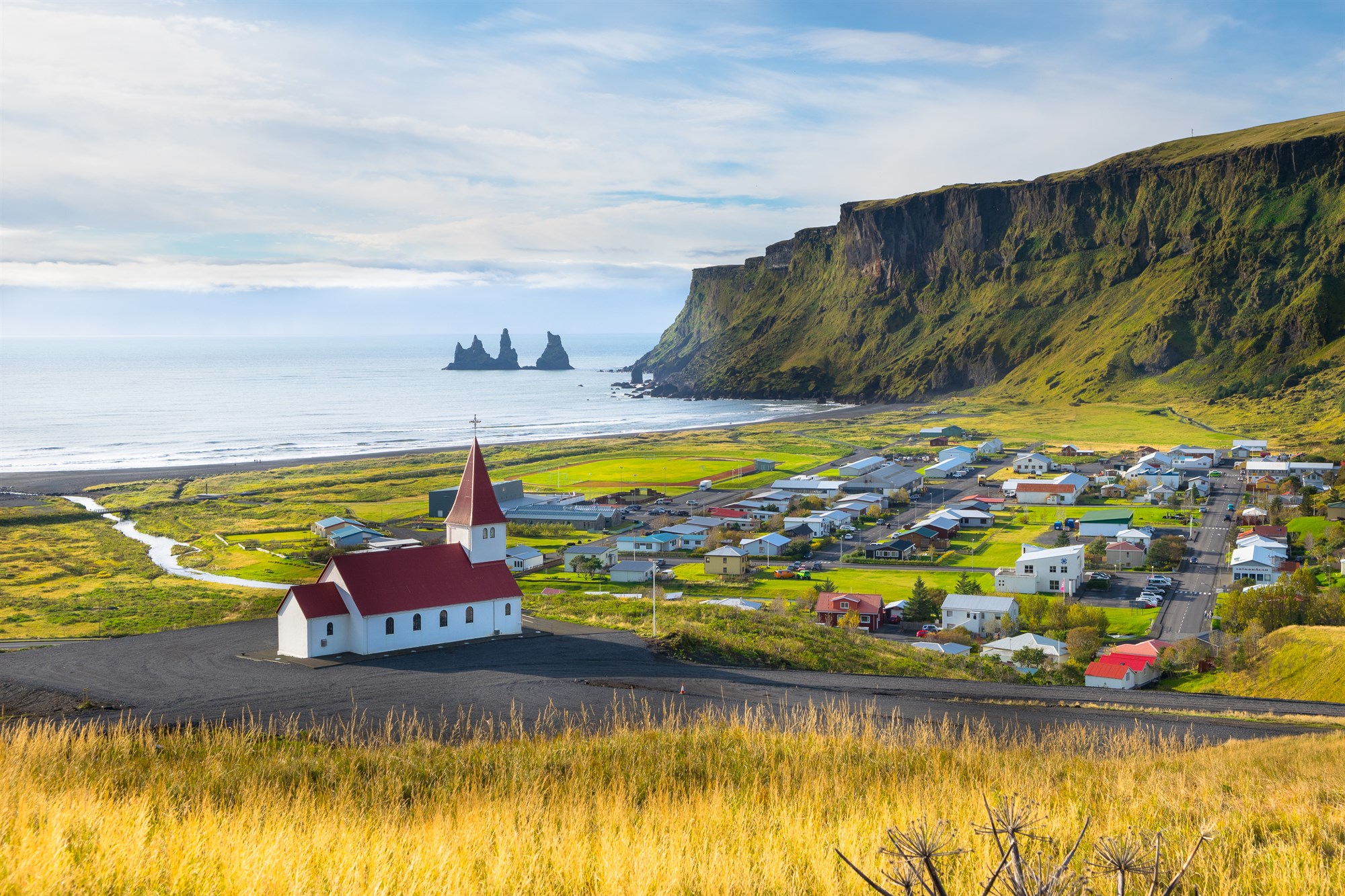 Vik and black sand beach on iceland's southern coast. 