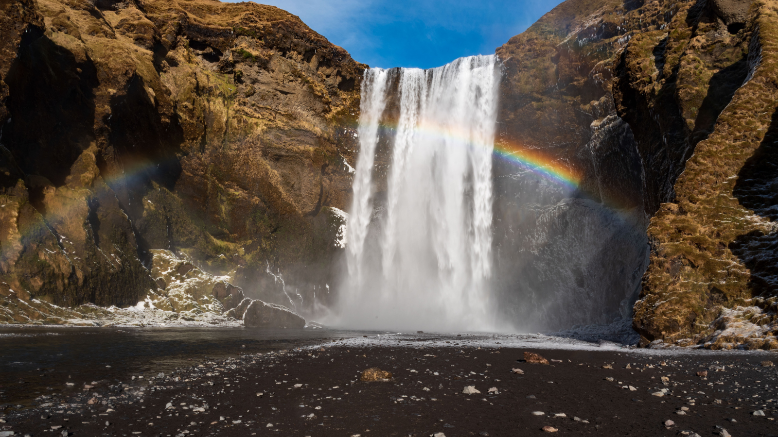 Skogafoss and rainbow in winer