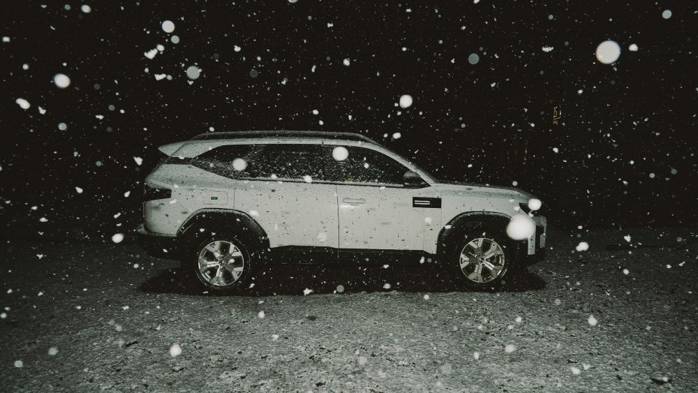 Iceland snowfall. White 4x4 in heavy snowfall in Iceland.