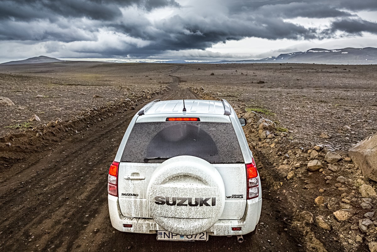 Suzuki Vitara driving with sand and ash protection