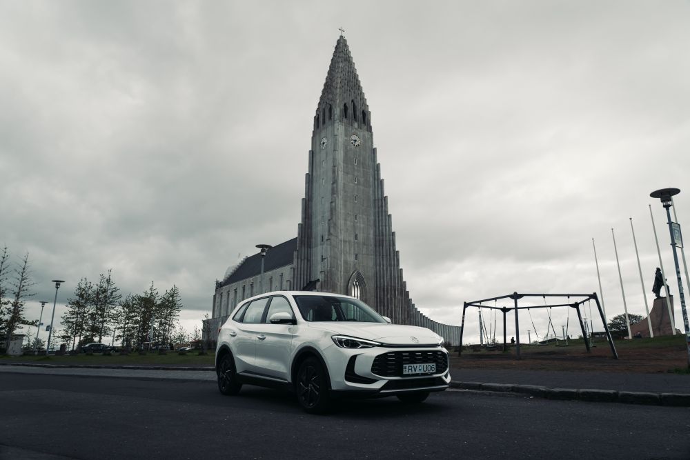 EV at Hallgrimskirkja church in Reykjavik. Electrice rental car in front of Hallgrimskirkja church in Reykjavik.