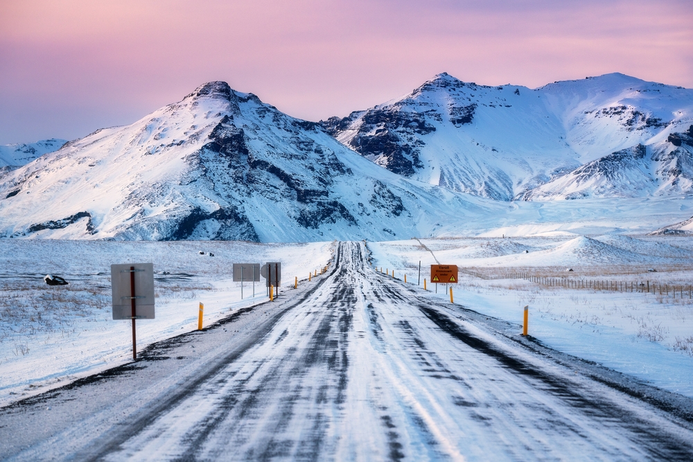 A road in winter conditions with snow in Iceland.